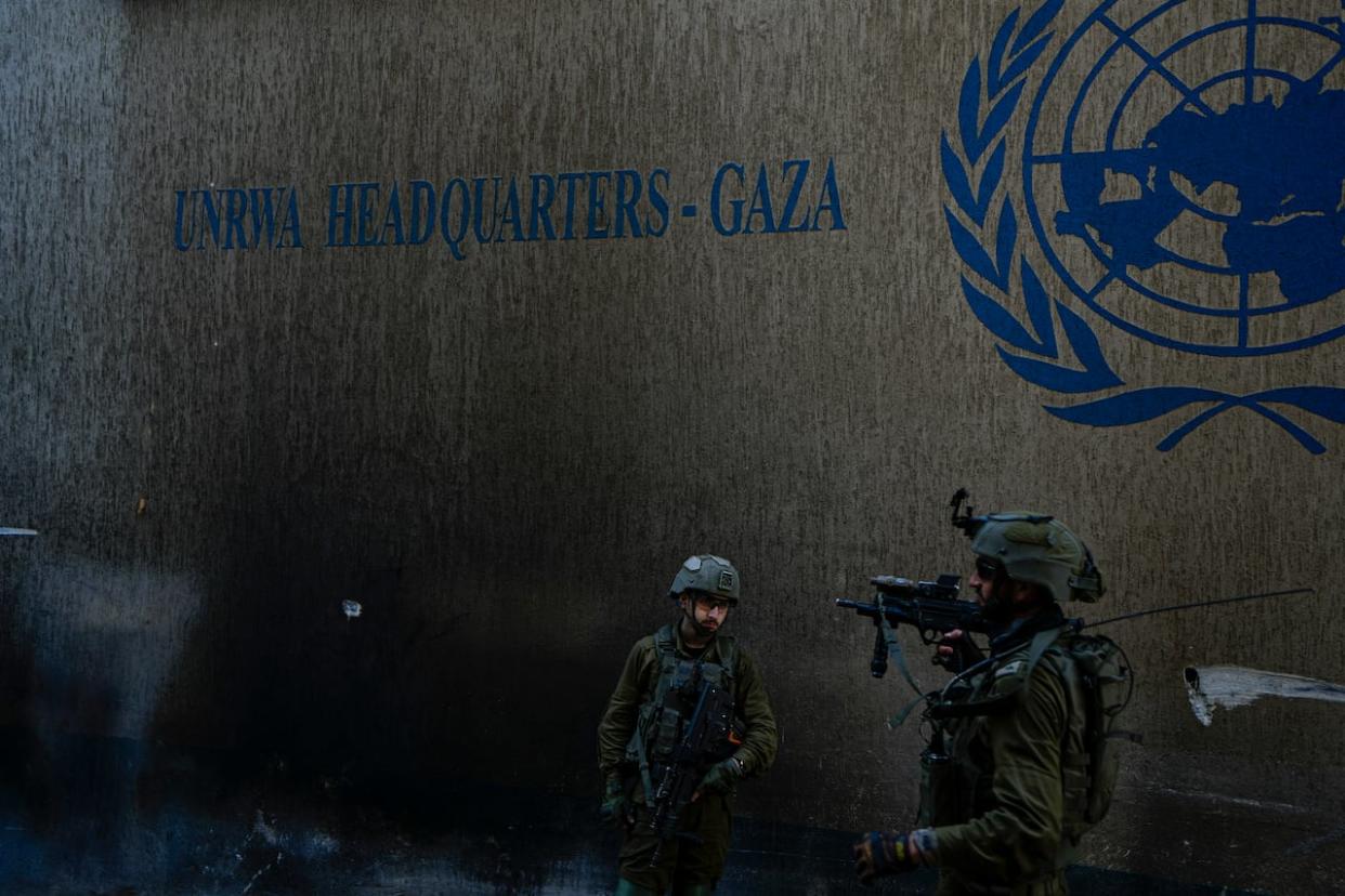 The Canadian government confirmed Friday it will resume funding to UNRWA. Israeli soldiers take up position as they enter the UNRWA headquarters, where the military discovered tunnels underneath the U.N. agency that the military says Hamas militants used to attack its forces during a ground operation in Gaza, Thursday, Feb. 8, 2024. (Ariel Schalit/AP Photo - image credit)