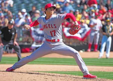 Apr 1, 2018; Oakland, CA, USA; Los Angeles Angels starting pitcher Shohei Ohtani (17) pitches the ball against the Oakland Athletics during the sixth inning at Oakland Coliseum. Kelley L Cox-USA TODAY Sports