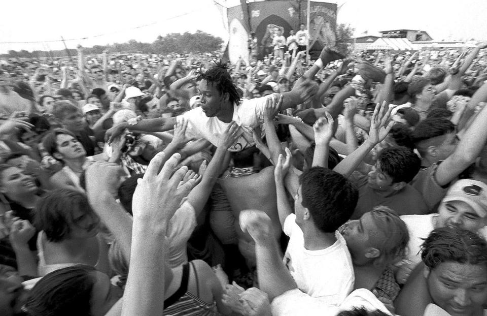 Van Damn of the Lost Boyz body surfs across the crowd during their performance at Lollapalooza at Texas Sky Festival Park in Corpus Christi on Aug. 3, 1997.