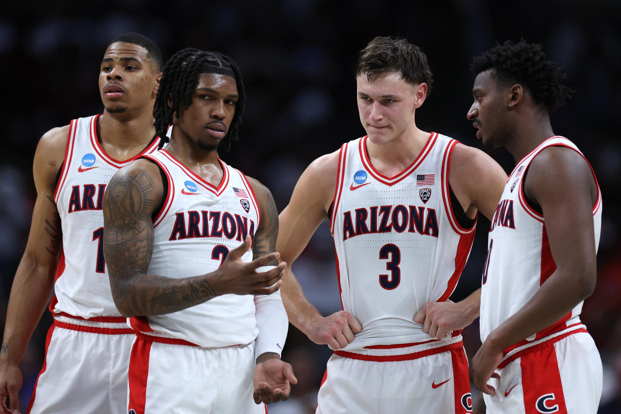 (From left) Keshad Johnson, Caleb Love, Pelle Larsson and Jaden Bradley of the Arizona Wildcats look on late during a loss to Clemson on Thursday. (Harry How/Getty Images)