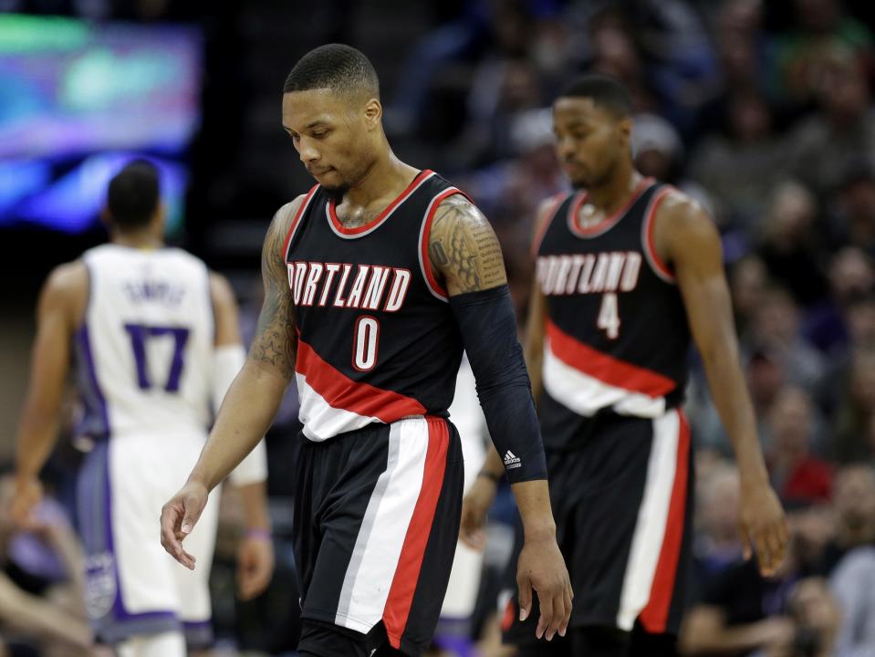 Damian Lillard and the Blazers have fielded one of the NBA's worst defenses. (AP)