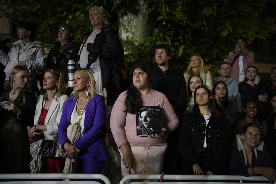 In this May 20, 2023 photo, festivalgoers wait for Leonardo DiCaprio outside of the premiere of the film 'Killers of the Flower Moon' at the 76th international film festival, Cannes, southern France. (AP Photo/Daniel Cole)