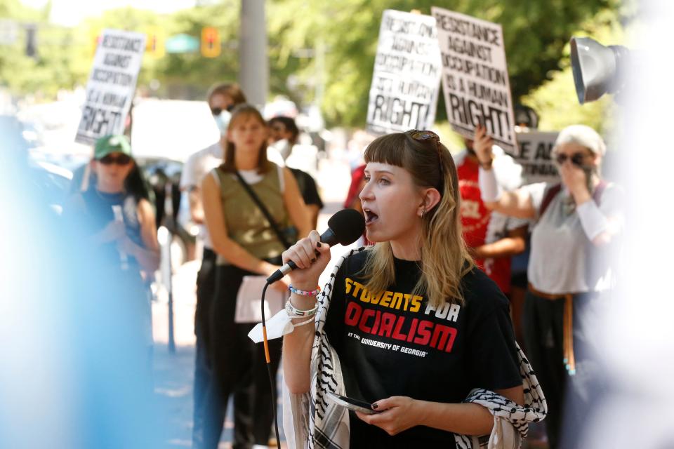 Students for Socialism lead a chant to during a protest at the University of Georgia Arch on Wednesday, May 1, 2024.