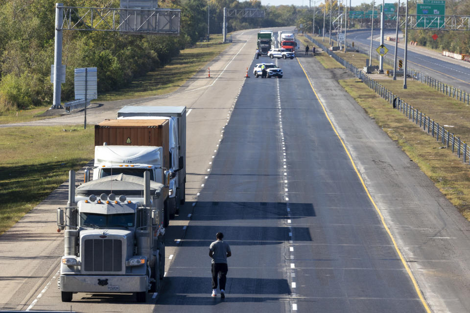 Truck drivers wait for Interstate 10 in New Orleans East to reopen as emergency crews work on two separate wrecks that closed the roadway in both directions after a morning of heavy smoke and fog on Tuesday, Nov. 7, 2023. Dense smoke reminiscent of last month's “super fog” that rolled into Louisiana has led to a deadly crash that shut down Interstate 10 in the New Orleans area early Tuesday, police said. (Chris Granger/The Times-Picayune/The New Orleans Advocate via AP)