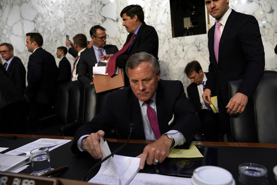 Sen. Richard Burr collects his notes after the hearing