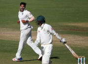 Cricket - India v Australia - First Test cricket match - Maharashtra Cricket Association Stadium, Pune, India - 23/02/17. India's Umesh Yadav celebrates the wicket of Australia's Nathan Lyon. REUTERS/Danish Siddiqui