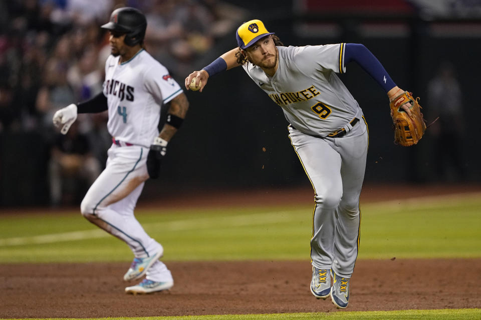 Milwaukee Brewers' Brian Anderson (9) fields a ground out hit by Arizona Diamondbacks' Christian Walker during the third inning of a baseball game, Monday, April 10, 2023, in Phoenix. (AP Photo/Matt York)