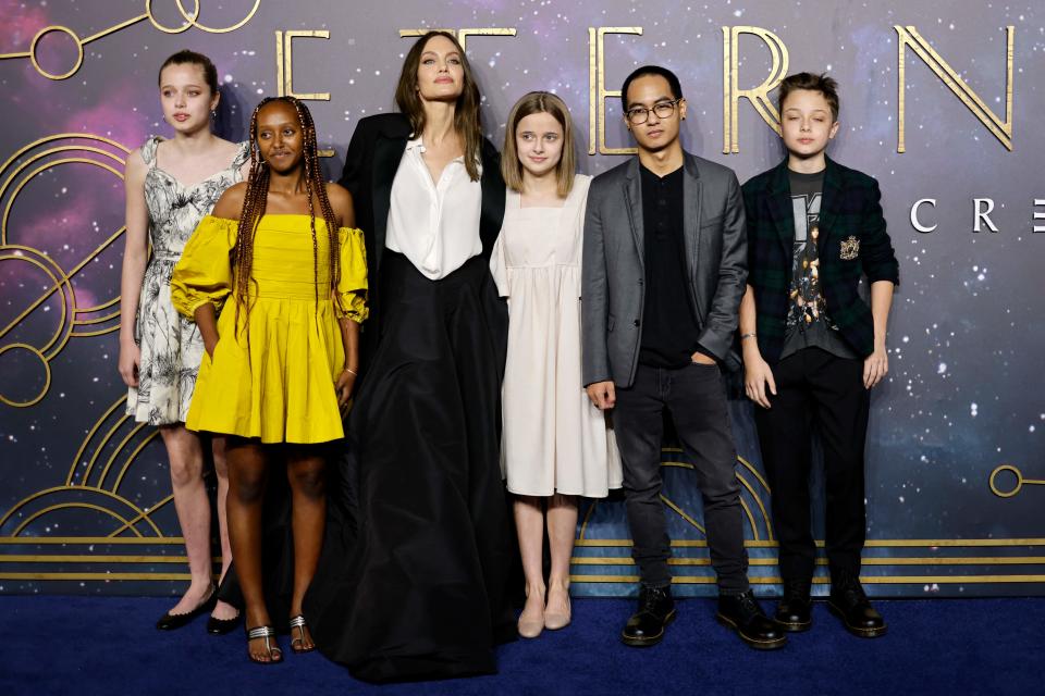 Angelina Jolie poses with five of her children, (L-R) Shiloh Jolie-Pitt, Zahara Jolie-Pitt, Vivienne Jolie-Pitt, Maddox Jolie-Pitt and Knox Jolie-Pitt, on the red carpet screening of "Eternals" in London on Oct. 27, 2021.