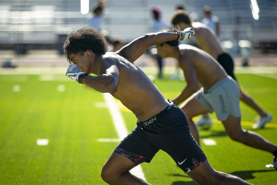 Defensive back Donovan Aidoo runs as part of a drill during spring football practice at Higley High School in Gilbert on May 5, 2022.