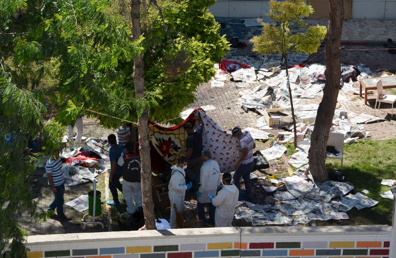 Police forensic experts examine after an explosion in Suruc in the southeastern Sanliurfa province, Turkey, July 20, 2015. REUTERS/Stringer