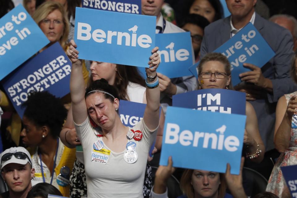 A disappointed supporter of former Democratic presidential candidate Sen. Bernie Sanders holds up her sign at the Democratic National Convention. (Photo: Mary Altaffer/AP Photo)