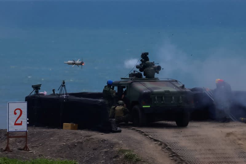 A solider launches a US-made TOW 2A missile during a live fire drill in Pingtung