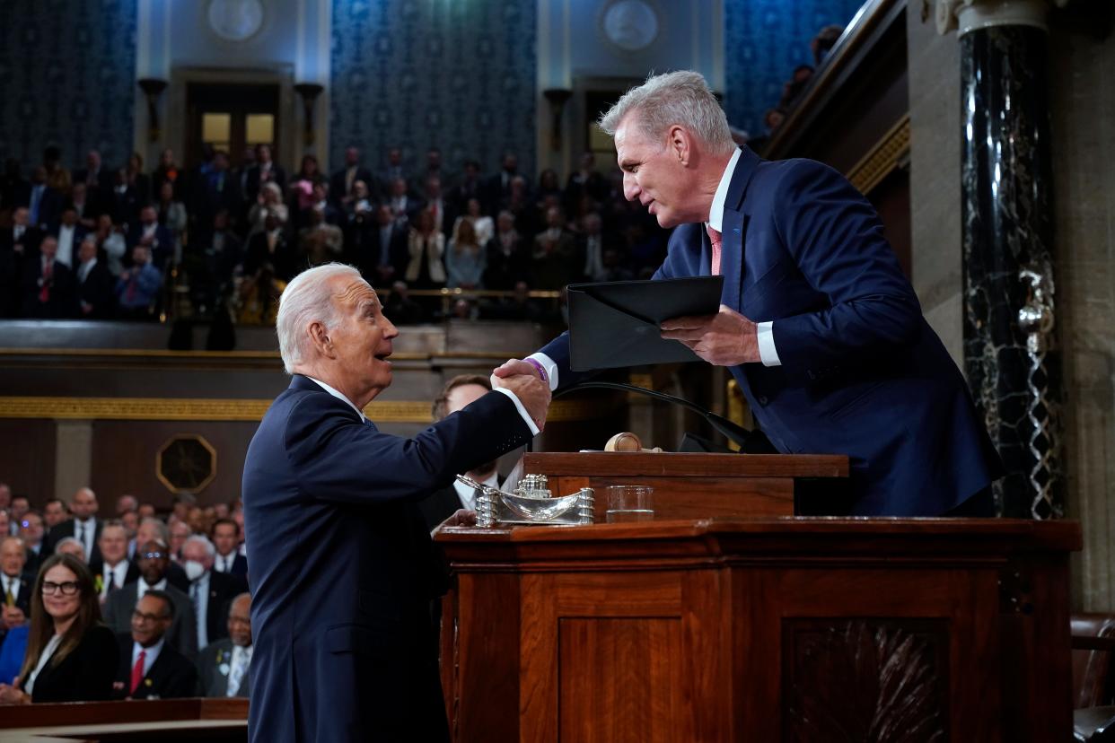 WASHINGTON, DC - FEBRUARY 07: US President Joe Biden shakes hands as he presents a copy of his speech to House Speaker Kevin McCarthy of Calif., before he delivers his State of the Union address to a joint session of Congress, on February 7, 2023 in the House Chamber of the U.S. Capitol in Washington, DC. The speech marks President Biden's first address to the new Republican-controlled House. (Photo by Jacquelyn Martin-Pool/Getty Images)
