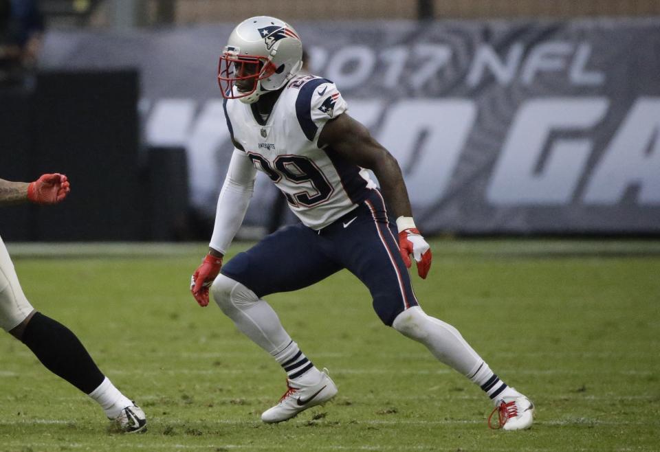 Floptastic: New England Patriots cornerback Johnson Bademosi had a dramatic overreaction to being hit with a football. (AP)