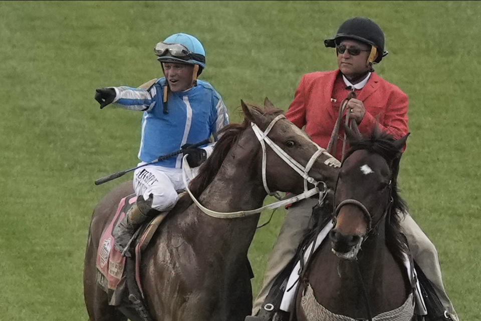 Javier Castellano celebrates after riding Mage to win the 149th running of the Kentucky Derby horse race at Churchill Downs Saturday, May 6, 2023, in Louisville, Ky. (AP Photo/Charlie Riedel)