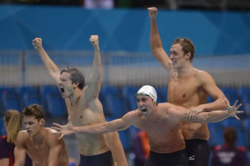 France's Clement Lefert, Amaury Leveaux and Fabien Gilot celebrate after winning the men's 4 x 100m freestyle relay at the London Olympic Games on July 29. Swimming powerhouses Australia were looking to regroup after the shattering blow of the team bombing out of the medals in the relay, where France pulled a stunning upset to win gold over the US at silver and Russia at bronze