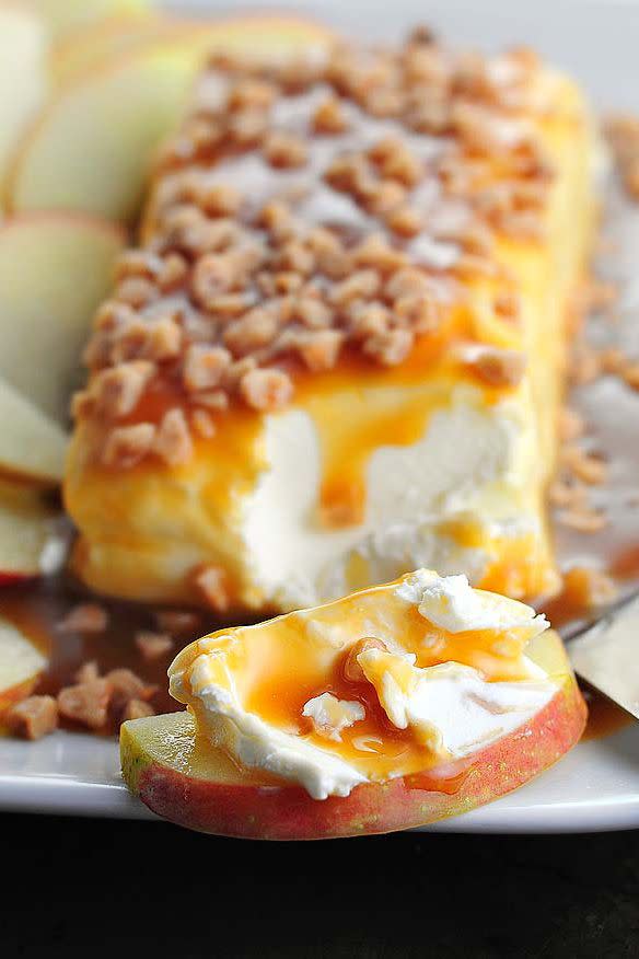 <p>This three-ingredient cheese spread is best served with apples at a fall tailgate party. </p><p><strong>Get the recipe at <a href="http://shewearsmanyhats.com/easy-caramel-apple-cream-cheese-spread" rel="nofollow noopener" target="_blank" data-ylk="slk:She Wears Many Hats;elm:context_link;itc:0;sec:content-canvas" class="link ">She Wears Many Hats</a>.</strong></p>