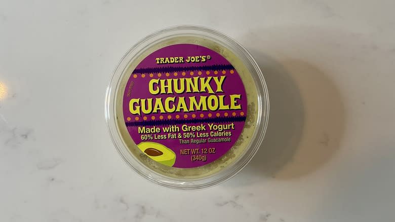 Pale green guacamole in container