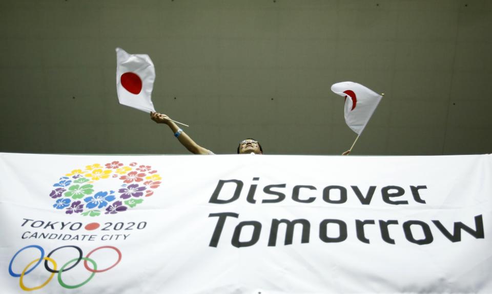 People celebrate after hearing that Tokyo had been chosen to host the 2020 Olympic Games during a public viewing event in Tokyo