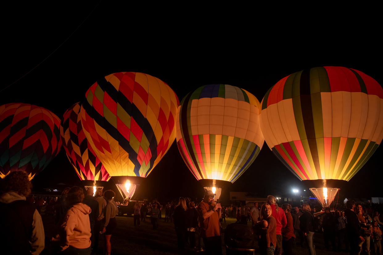 Balloons light up the night sky at Sunbeau Valley Farm in Ravenna during the 2023 Friday night Balloon A-Fair Night Glow.