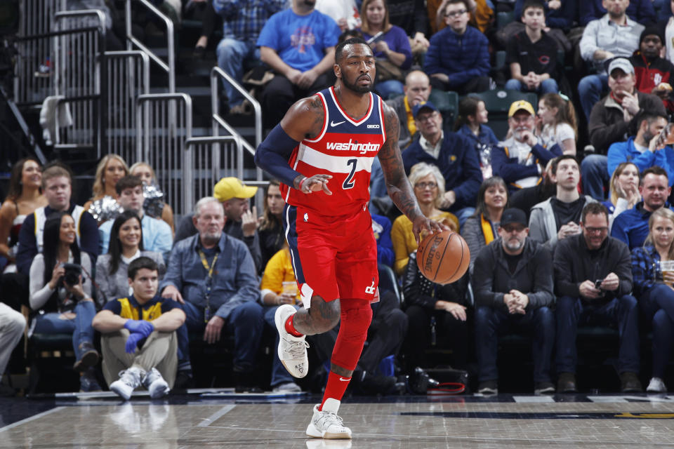 Though he isn't likely to play season after an Achilles injury, John Wall defended the massive contract the Wizards gave him — and reaffirmed his commitment to play there his entire career.