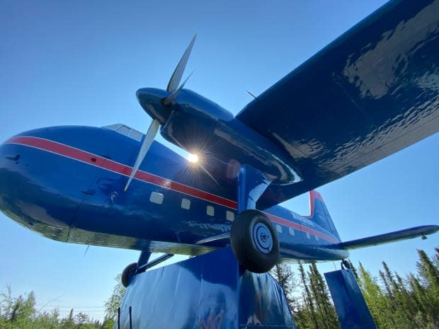 The historic plane at the entrance into Yellowknife sits at an entry point to Yellowknife as a monument to aviation and its role in opening up Canada's North. But for Ernie Bernhardt, it represents something more ominous: the role of aviation in ferrying Indigenous children to residential schools away from their homes.  (Chantal Dubuc/CBC - image credit)