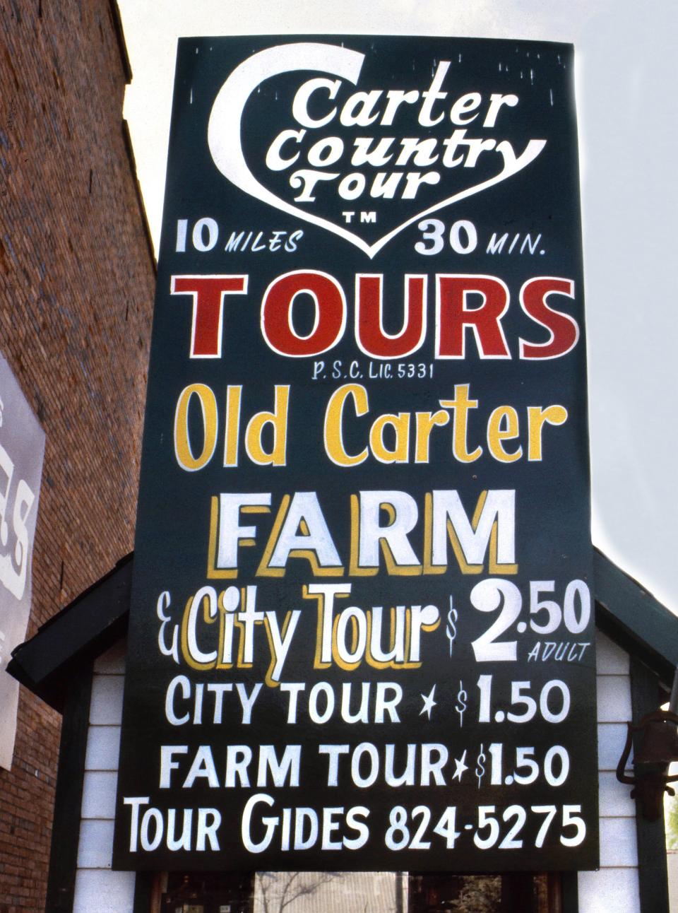A sign in Plains, Georgia, advertises tours of the city and Carter family peanut farm