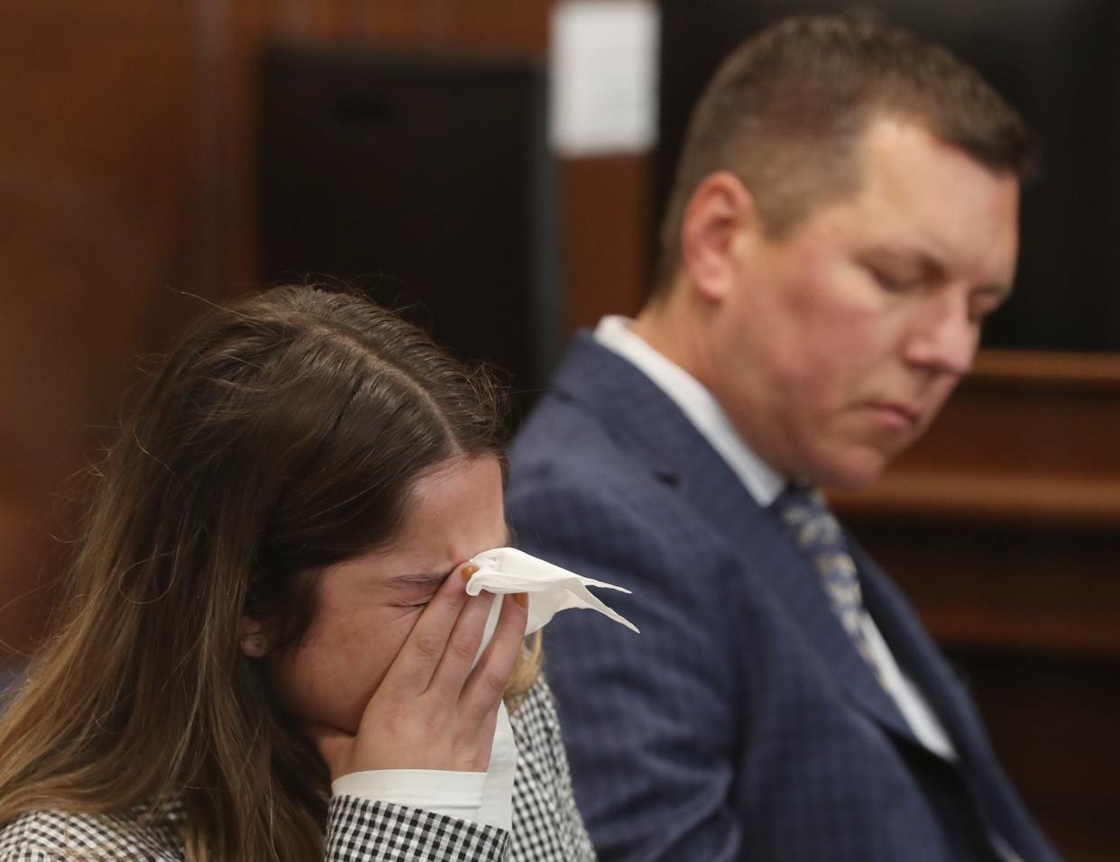 Sydney Powell reacts to a guilty verdict as she sits with her attorney Don Malarcik in Summit County Common Pleas Judge Kelly McLaughlin's courtroom. Powell was found guilty for the stabbing death of her mother.