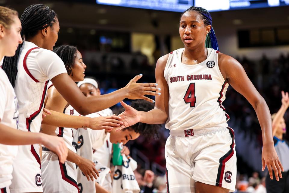 Jan 22, 2023; Columbia, South Carolina, USA; South Carolina Gamecocks forward Aliyah Boston (4) is congratulated after being pulled from the game against the Arkansas Razorbacks in the second half at Colonial Life Arena. Mandatory Credit: Jeff Blake-USA TODAY Sports