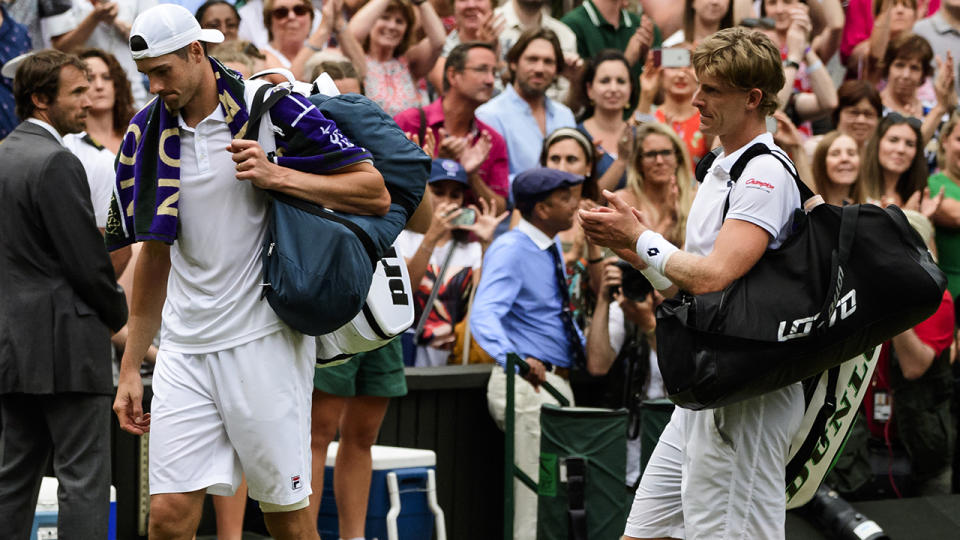 LONDON, ENGLAND – JULY 13: Kevin Anderson of South Africa applauds John Isner of the United States as he leaves the court after their semi final match in the gentlemen’s singles at the All England Lawn Tennis and Croquet Club on July 13, 2018 in London, England. (Photo by TPN/Getty Images)