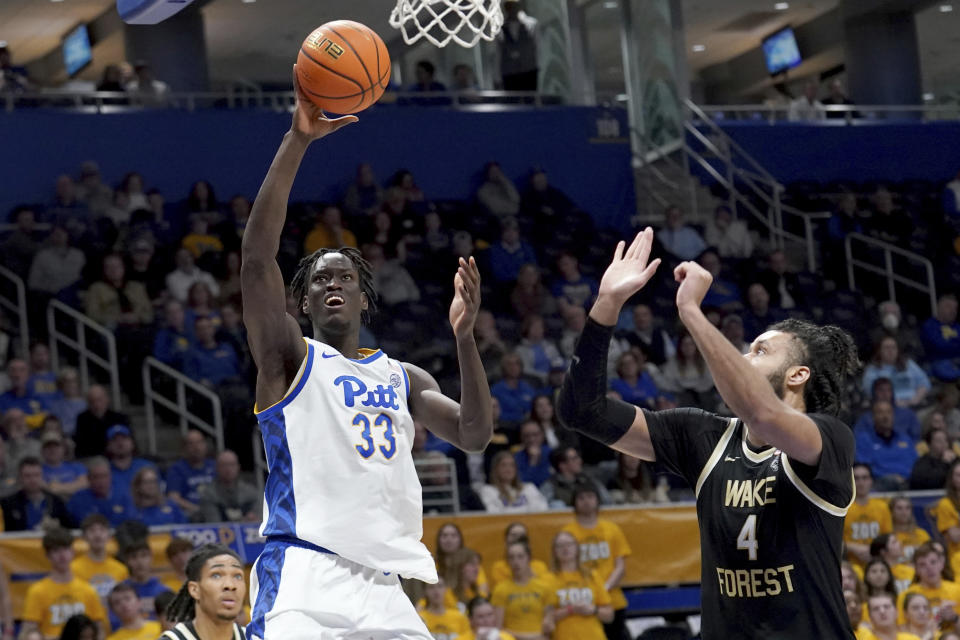 Pittsburgh center Federiko Federiko (33) puts up a shot over Wake Forest forward Efton Reid III (4) during the second half of an NCAA college basketball game Wednesday, Jan. 31, 2024, in Pittsburgh. (AP Photo/Matt Freed)