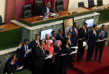 Ethiopian cabinet ministers jointly take their oath of office during a ceremony at the House of Peoples' Representatives in Addis Ababa, Ethiopia April 19, 2018. REUTERS/Tiksa Negeri