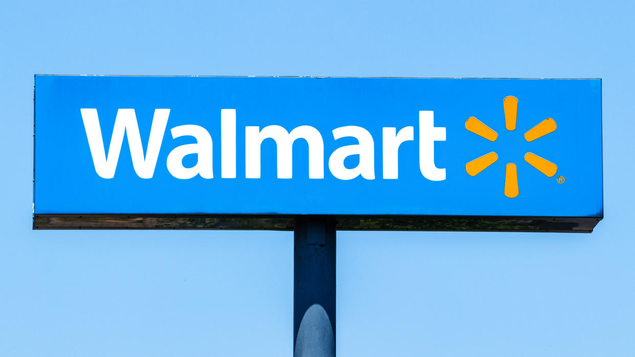  Walmart sign shown against blue sky 