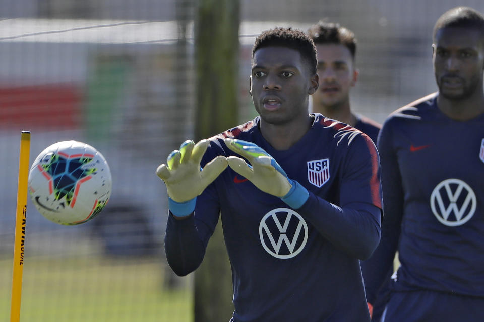 Sean Johnson, a goalkeeper on the U.S. National Men's Soccer team, makes save Wednesday, Jan. 8, 2020, in Bradenton, Fla. The team moved its training camp from Qatar to Florida in the wake of Iran's top military commander being killed during a U.S. airstrike in the Middle East. (AP Photo/Chris O'Meara)