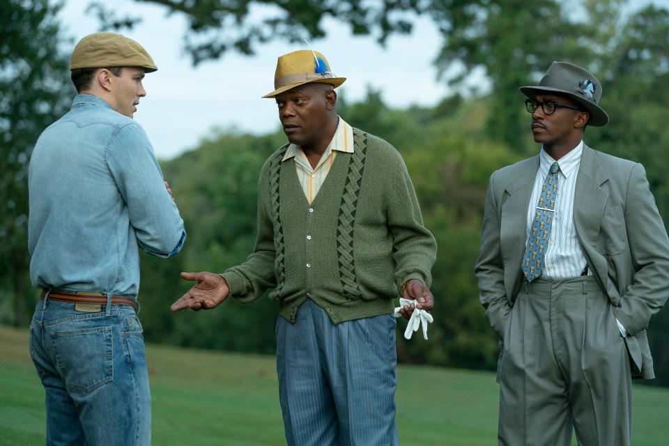 This image released by Apple TV Plus shows Nicholas Hoult, from left, Samuel L. Jackson, and Anthony Mackie in a scene from "The Banker." (Apple TV Plus via AP)