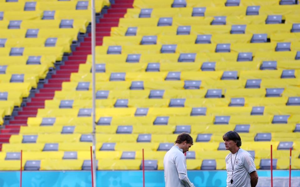 Joachim Low looks lost in thought during a training session at the Allianz Arena - REUTERS