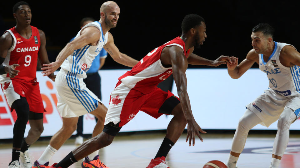 Canada's Andrew Wiggins looks for an open man as Greece players try to steal the ball. (THE CANADIAN PRESS/Chad Hipolito)