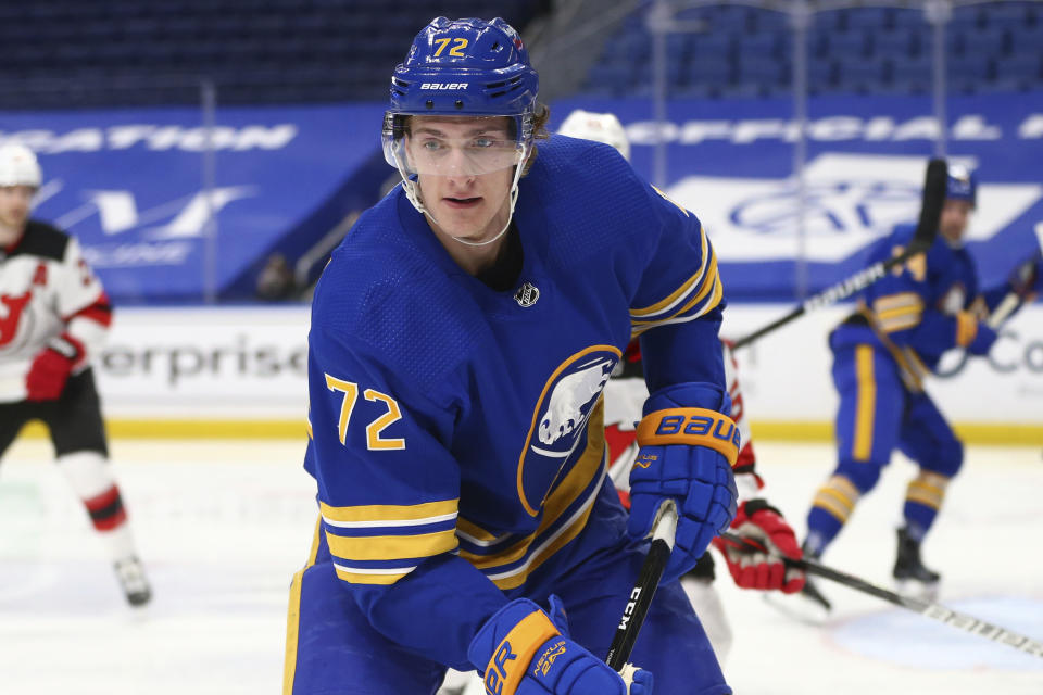 Buffalo Sabres forward Tage Thompson (72) chases the puck into the corner during the second period of the team's NHL hockey game against the New Jersey Devils, Thursday, April 8, 2021, in Buffalo, N.Y. (AP Photo/Jeffrey T. Barnes)