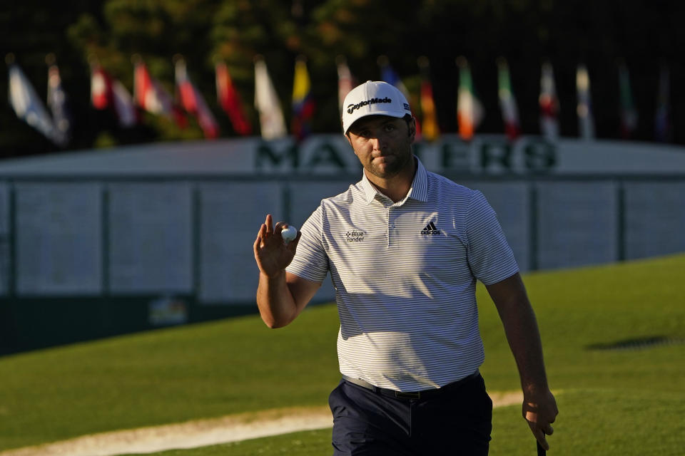 Jon Rahm, of Spain, holds his ball after a birdie on the ninth green during the second round of the Masters golf tournament Friday, Nov. 13, 2020, in Augusta, Ga. (AP Photo/Chris Carlson)