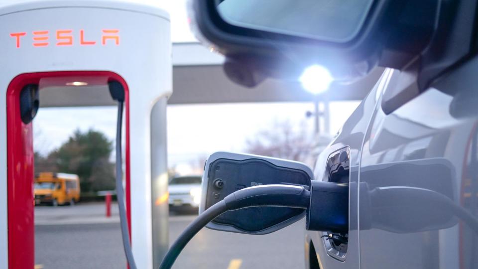 Ford F150 Lightning charging at Tesla station