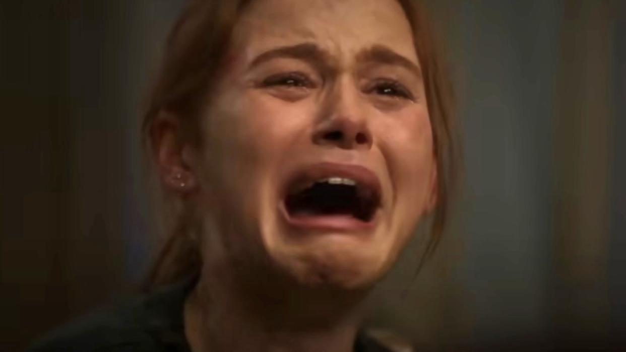  A close-up of Madelaine Petsch's face as Maya. Maya is crying and screaming with her mouth wide open in horror in the movie The Strangers: Chapter 1. 