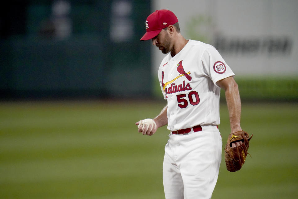 St. Louis Cardinals starting pitcher Adam Wainwright pauses on the mound after giving up a two-run home run to Cincinnati Reds' Joey Votto during the first inning of a baseball game Friday, Sept. 11, 2020, in St. Louis. (AP Photo/Jeff Roberson)