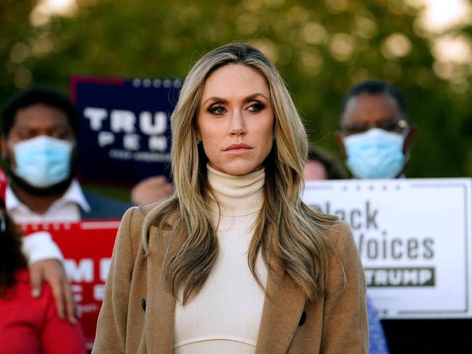 <p>Lara Trump, daughter-in-law of Donald Trump listens to Rudy Giuliani speak during a news conference on legal challenges to vote counting in Pennsylvania earlier this month</p> (AP)