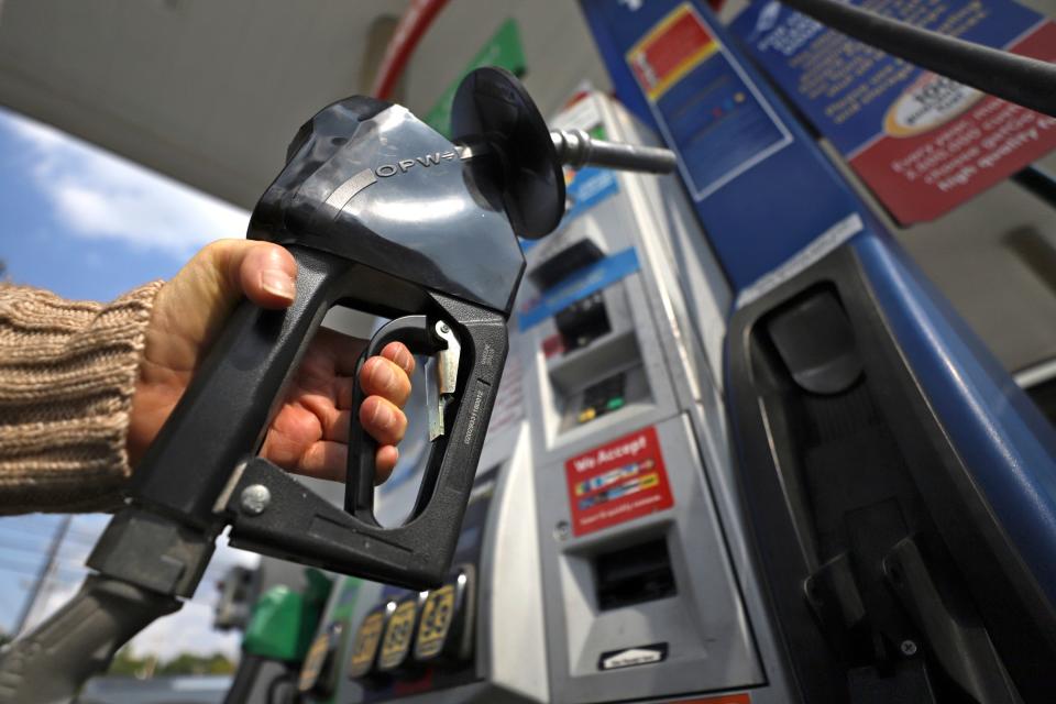 A woman pumps gas at a gas pump at a convenience store in Pittsburgh Monday, Sept. 16, 2019. (AP Photo/Gene J. Puskar) ORG XMIT: PAGP