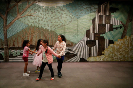 Kurdish children play outside the venue of a political rally ahead of Turkey's parliamentary elections in northern Tokyo, October 15, 2015. REUTERS/Toru Hanai