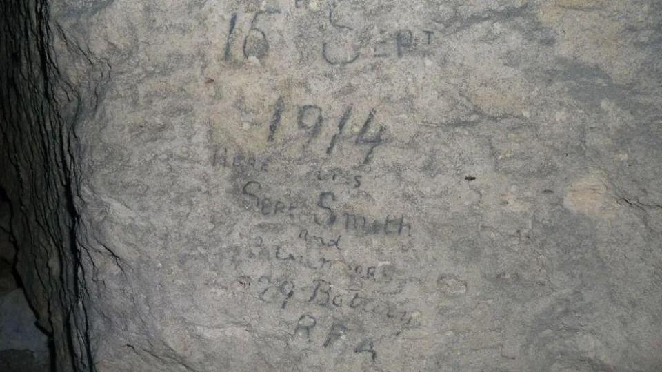 Cave drawings read: "September 15, 1914, here lie Sjt Smith and 3 Gnrs, 29th Battery RFA"