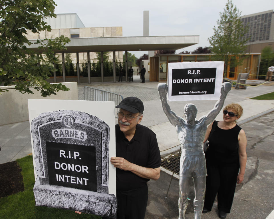 Protestors picket outside a preview of The Barnes Foundation Wednesday, May 16, 2012, in Philadelphia. After years of bitter court fights, the Barnes Foundation is scheduled to open its doors to the public on May 19 at its new location on Philadelphia's "museum mile." (AP Photo/Matt Rourke)