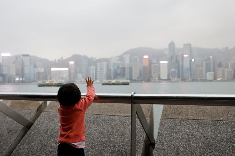 The Wider Image: Leaving Hong Kong: A family makes a wrenching decision