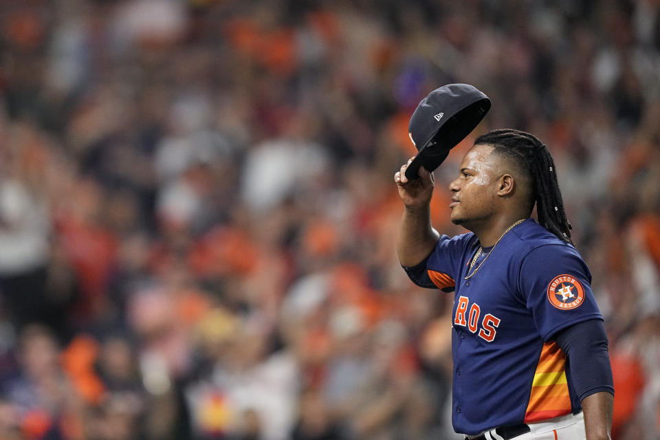 Houston Astros starting pitcher Framber Valdez tips his cap as he leaves the game during the seventh inning in Game 2 of baseball's World Series between the Houston Astros and the Philadelphia Phillies on Saturday, Oct. 29, 2022, in Houston. (AP Photo/David J. Phillip)