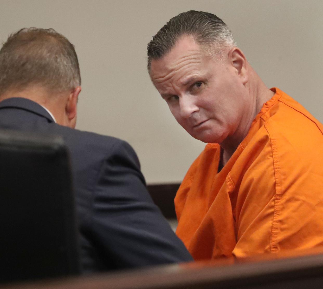 Shane Jackson looks around the courtroom as he speaks with his defense attorney Michael Panella, Monday, Oct. 2, 2023, before a sentencing hearing in Circuit Judge Leah Case's courtroom at the Justice Center.